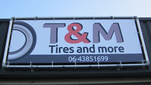 T & M Tires logo